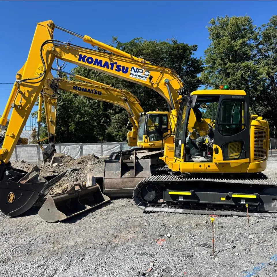 Diggers and truck on site